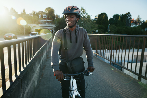 Cyclist Riding Bike in City Setting