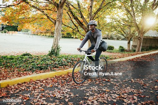 istock Cyclist Riding Bike in City Setting 1433006381