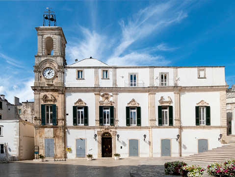 old university palace with clock tower at piazza plebiscito in Martina Franca, Italy