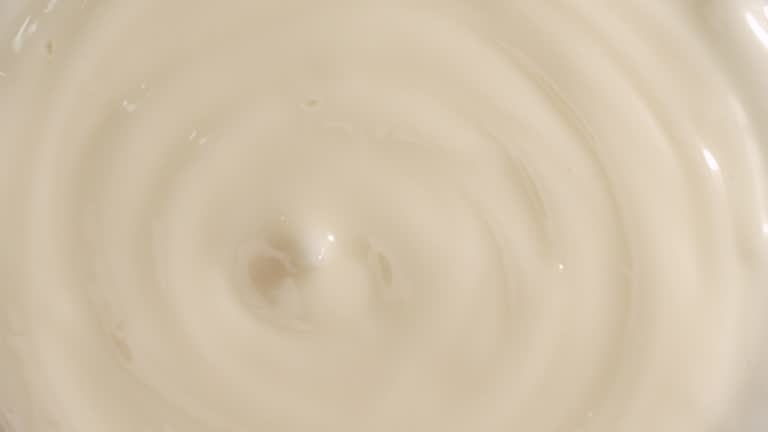 Close up shot of rotating mayonnaise swirl.