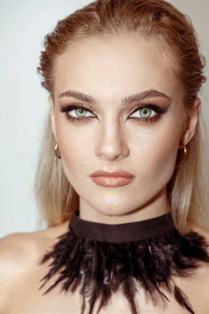 istock Beautiful woman with smokey makeup close up studio portrait 1433011380