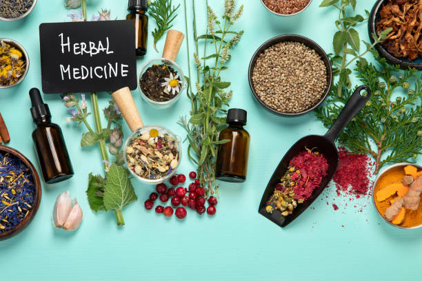 istock Alternative herbal medicine on green background. 1433012935