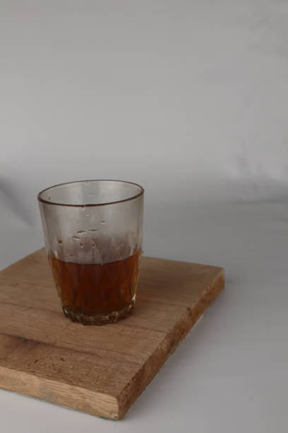 istock a glass of warm tea on a white background 1433013496