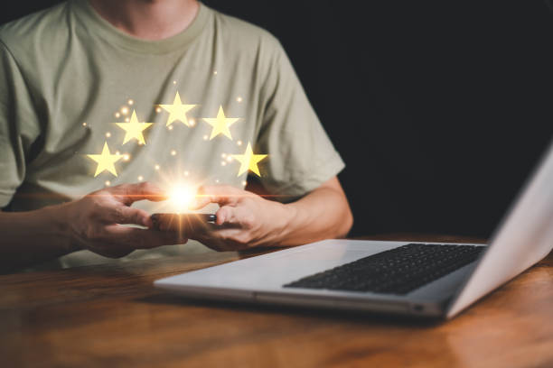 istock 5 Star rating on hand man with smartphone. Customer evaluation feedback. Customer service evaluation and satisfaction and feedback survey concept for best excellent business rating experience. 1433013822