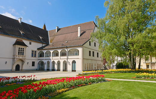 Wels, Austria - May 5, 2022: Visit to the 800 year old city of Wels. The public garden (Burggarten) with the old castle where Emperor Maximilian I died on January 12, 1519.  The Imperial Castle of Wels is a castle-like fortress in the middle of the city center of Wels and is used for museum purposes. The owner of the castle is the city of Wels.
