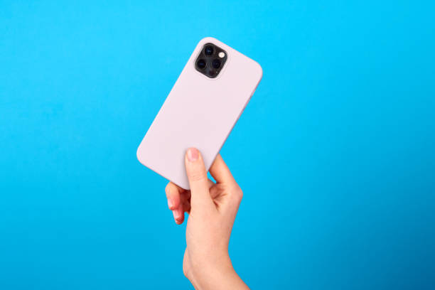 istock Crop person demonstrating mobile phone in studio 1433020430