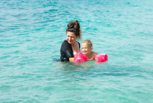 istock Mother teaches her daughter to swim. 1433023621