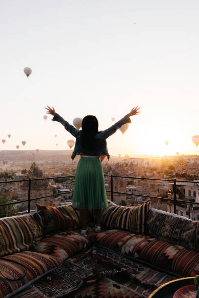 istock woman  is standing with hot balloon view 1433023740