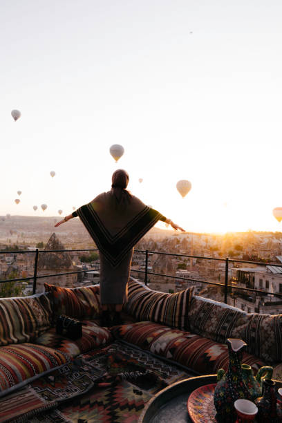 istock A young muslim woman  is standing with hot balloon view 1433023751