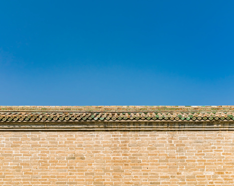 Brick wall with green tiles at Temple of Heaven in Beijing, China