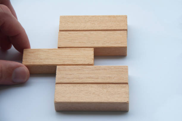 istock hand placing a wooden block with customizable space for text or ideas. Copy space 1433028618