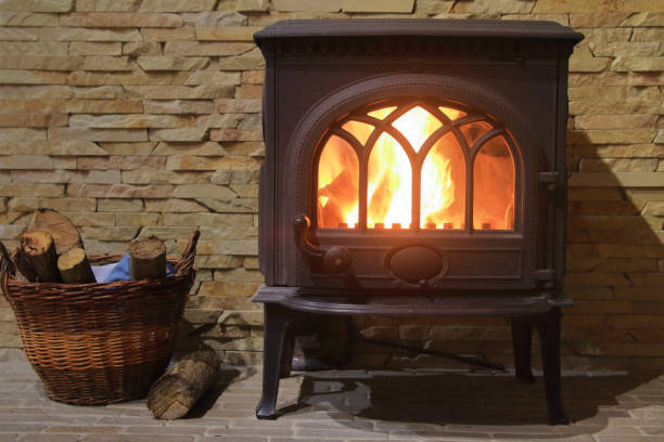 istock Cast iron stove with burning wood inside. 1433029804