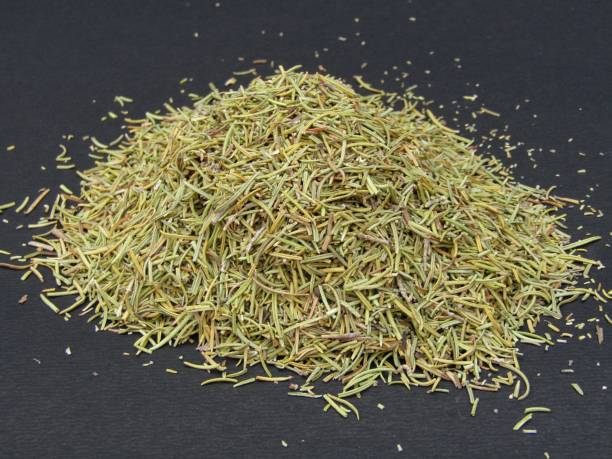 istock Dried rosemary leaves on black background 1433030839
