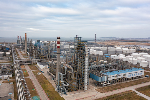 Aerial photography of large chemical plants under cloudy sky