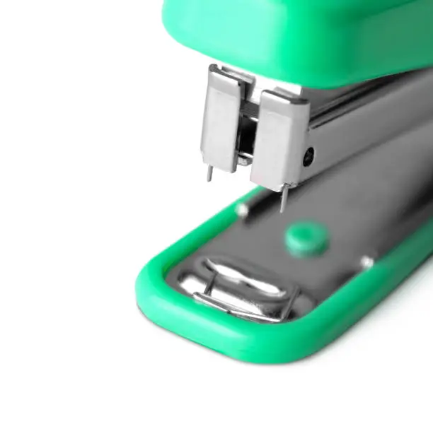 plastic stapler green isolated on white background