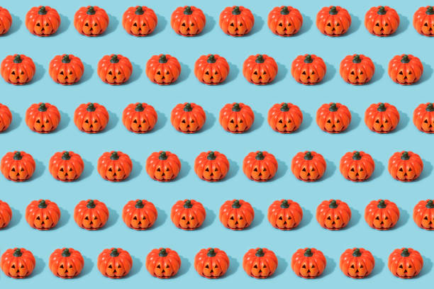 istock Jack-O-Lanterns on blue background. Halloween concept. Seamless pattern 1433037756