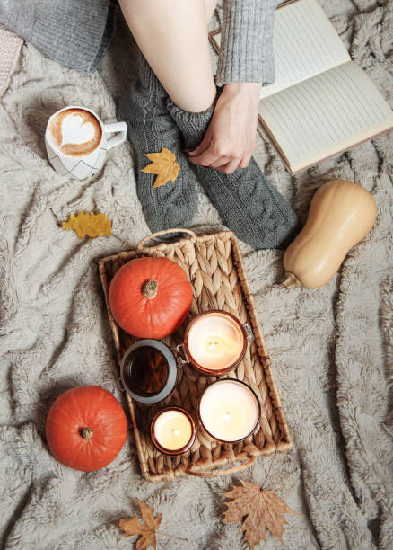 istock A girl in a sweater and knitted socks sits on a blanket 1433037892