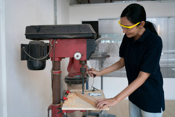 istock Smiling Indian woman working in carpentry workshop 1433040789