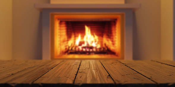 Empty wooden table on burning fireplace background, Warm home, living room interior, front view, 3d render