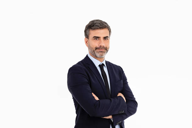 istock Businessman smiling with arms crossed on white background 1433041289