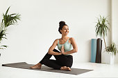 Portrait Of Beautiful Young Female Making Yoga Practice In Light Studio