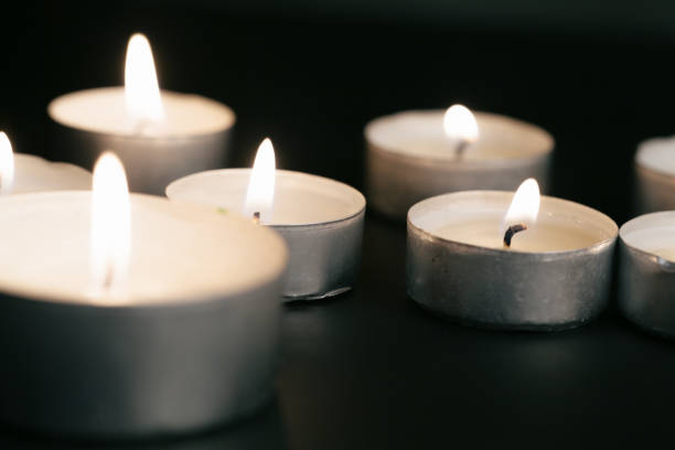 istock Candles Burning at Night. White Candles Burning in the Dark 1433045805