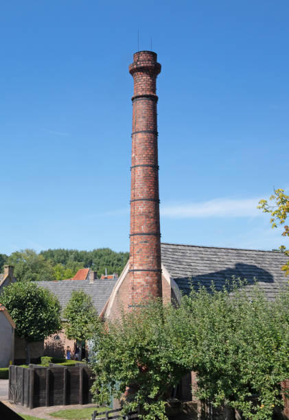 istock Old industrial brick chimney, blue sky 1433047477