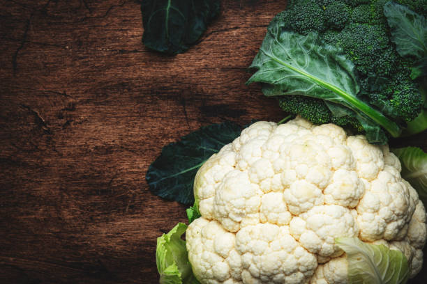 istock Autumn food background with cauliflower and broccoli on old rustic wood kitchen table, top view, copy space 1433047690