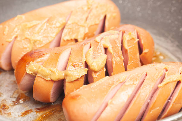 istock grilled sausages in a frying pan with mustard 1433049086