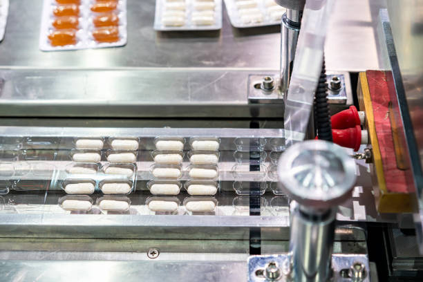 istock capsules wrapped in ptp sheet during manufacturing process by machine blister packing machine for pharmaceutical in industrial 1433050368