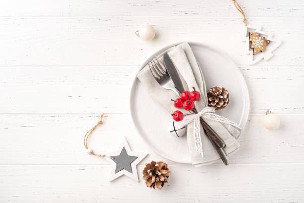 istock Christmas place setting on white wooden table. 1433050606