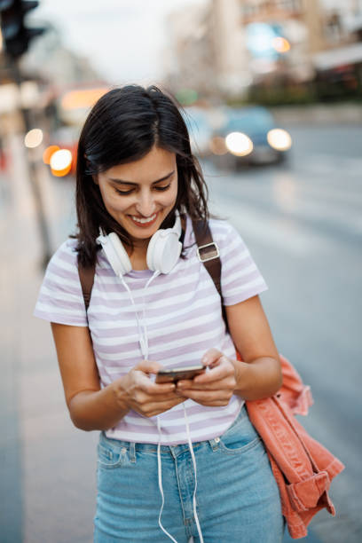 istock Woman using phone in city 1433050942