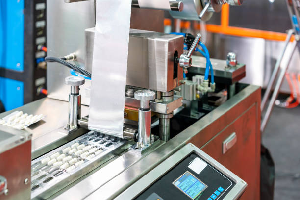 istock capsules wrapped in ptp sheet during manufacturing process by machine blister packing machine for pharmaceutical in industrial 1433050987