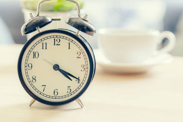 istock Morning sun. Alarm clock on a beautiful background 1433050990