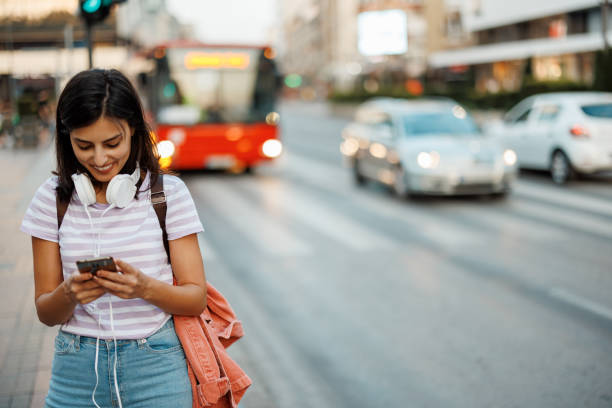 istock Woman using phone in city 1433052032
