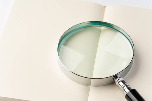 istock Books and Magnifying Glass 1433052264