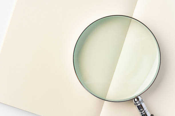 istock Books and Magnifying Glass 1433052285