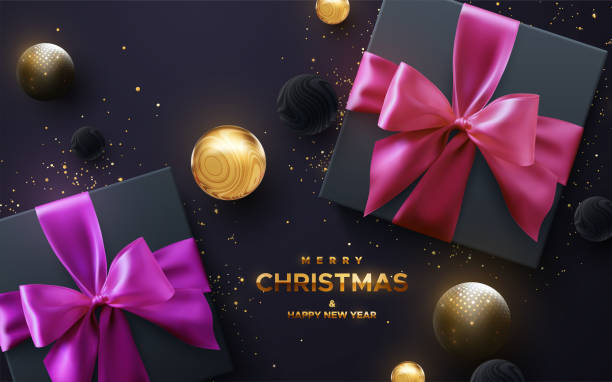 с новым годом и золотым знаком с новым годом. черные подарочные коробки с розовым и желтым бантом и лентами на черном фоне. - pink christmas christmas ornament sphere stock illustrations