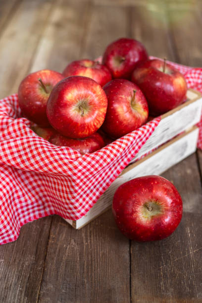 istock Fresh red apples in wooden box 1433053967