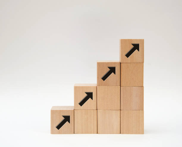 istock arrow sign on wood blocks step  up for business growth concept 1433053995