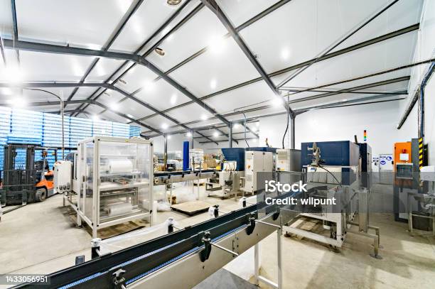 Water Bottling Facility Equipment And Conveyer Belts Stock Photo - Download Image Now