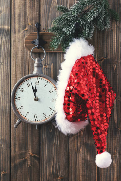 istock Red santa hat hanging on wooden wall. 1433058821