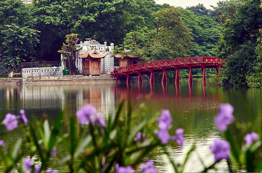beautiful red bridge over the lake. Eastern culture. High quality photo