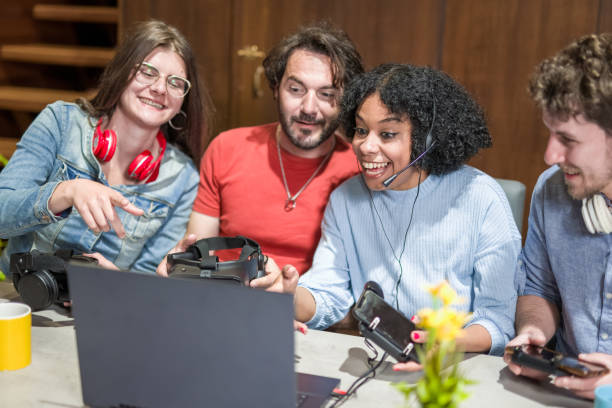 istock Team of gamers, young people and different influencers having fun while testing headset and portable device for gaming, streaming and broadcasting influencer concept, focus on biracial woman 1433060171