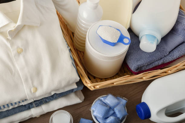 istock Laundry detergents on wooden table with clothes elevated view 1433060337