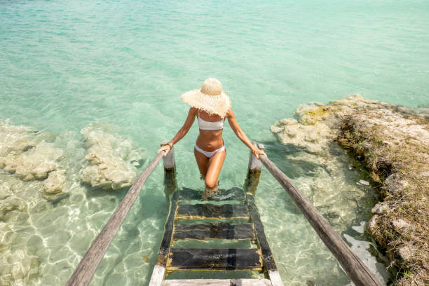 istock Woman relaxing in nature above blue lagoon 1433060675