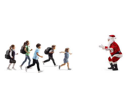 Group of children running towards santa claus isolated on white background