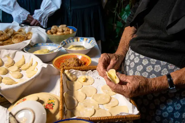 preparation of Sardinian culurgiones. Typical fresh pasta filled with potatoes and mint, Sardinia, Italy