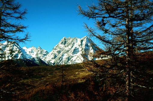 Baima (or Baimang) Snow Mountain, located in the northwest of Yunnan Province, near Tibet. the main peak is 5640 m asl. It is a national nature reserve in China. Photographic slide photo in Nov 2006, Deqin County, Yunnan