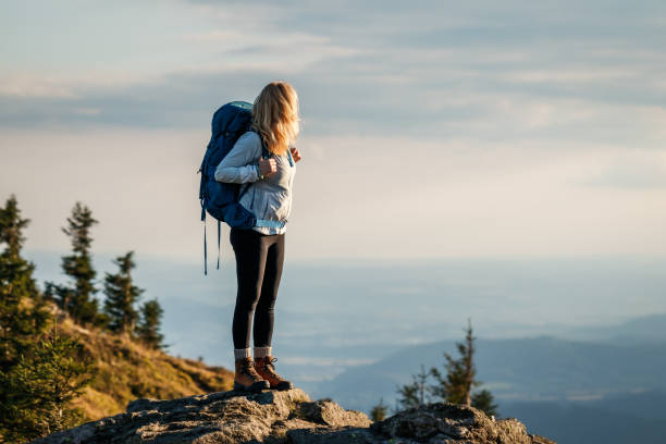 istock Woman hiking in mountains 1433063883